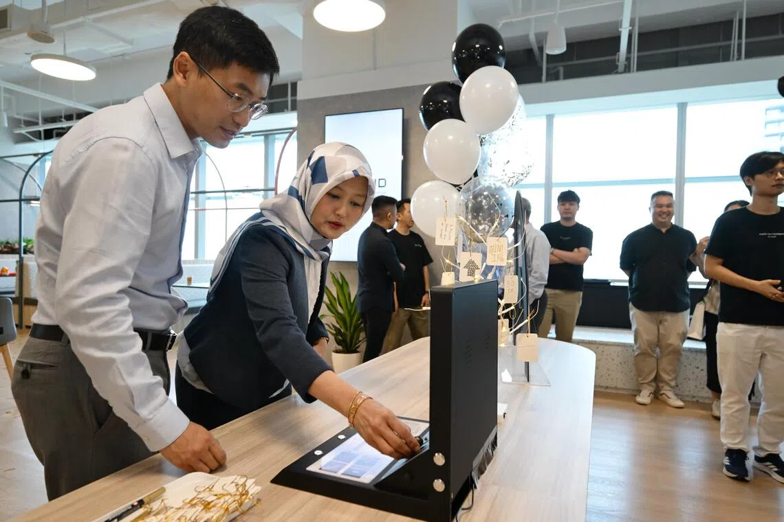 Minister of State for Digital Development and Information Rahayu Mahzam and Plaud CEO Nathan Xu at the opening of Plaud’s Asia-Pacific headquarters on Sept 16.