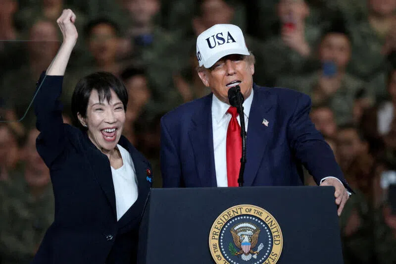 Japanese Prime Minister Sanae Takaichi and  US President Donald Trump aboard the aircraft carrier USS George Washington, during their visit to the US Navy's Yokosuka base in Japan in October.