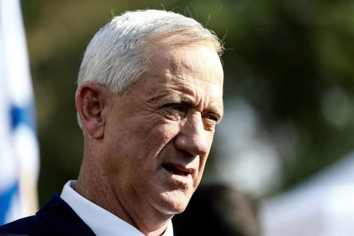 FILE PHOTO: Israeli Defense Minister Benny Gantz speaks to the media after casting his ballot on the day of Israel's general election outside a polling station in Rosh Ha'ayin, Israel November 1, 2022. REUTERS/Nir Elias/File Photo