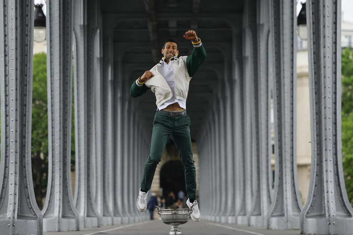 Serbia's Novak Djokovic posing with the trophy after winning the men's singles French Open title.