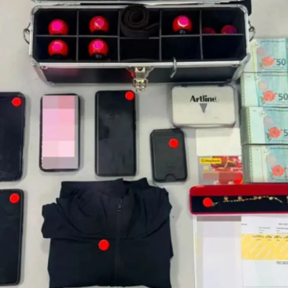 Mobile phones, premises keys, jewellery, immigration security stamps and $6,250 in cash were seized.