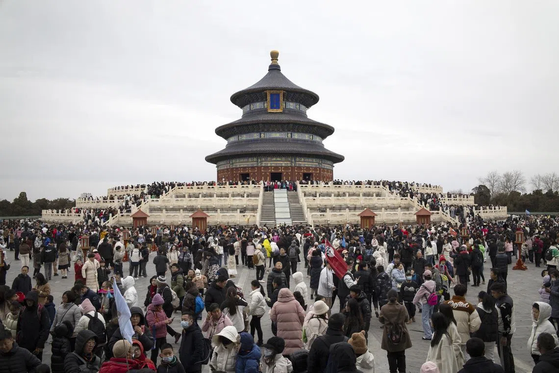Visitors gather at the Temple of Heaven during celebrations of Chinese New Year in Beijing, on Feb 14.