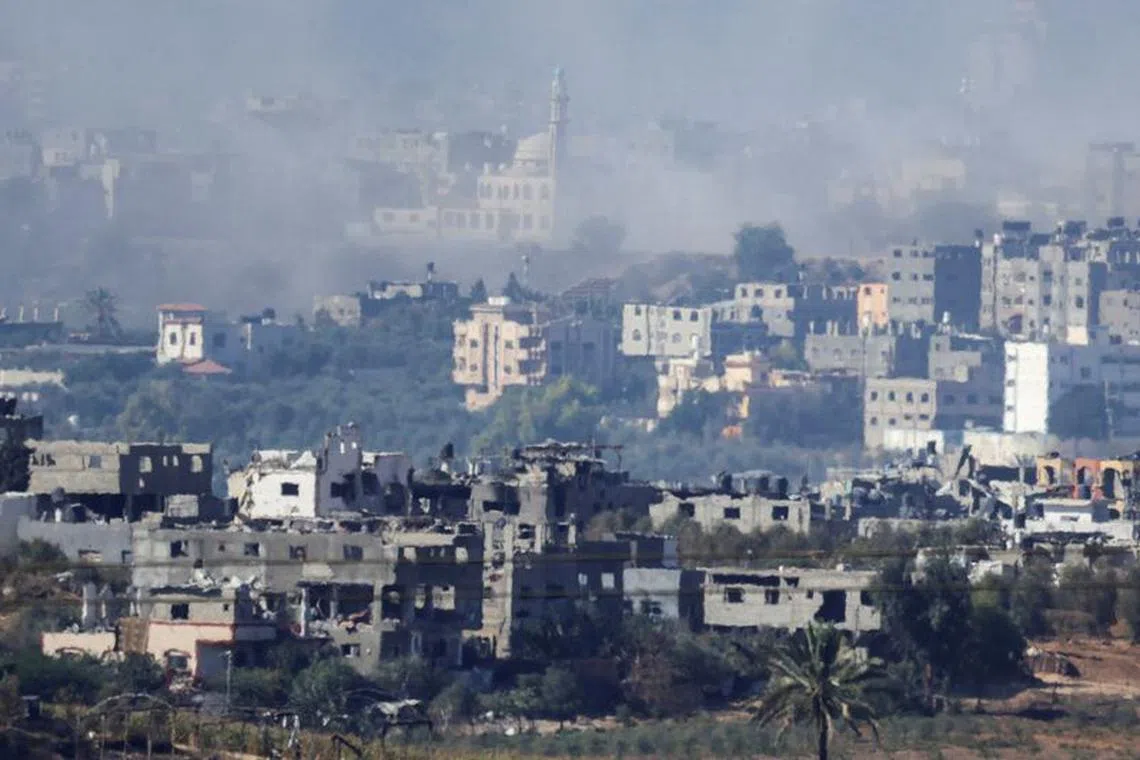 FILE PHOTO: A view of damaged buildings in Gaza, amid the ongoing conflict between Israel and Palestinian Islamist group Hamas, as seen from southern Israel, November 4, 2023. REUTERS/Evelyn Hockstein/File photo