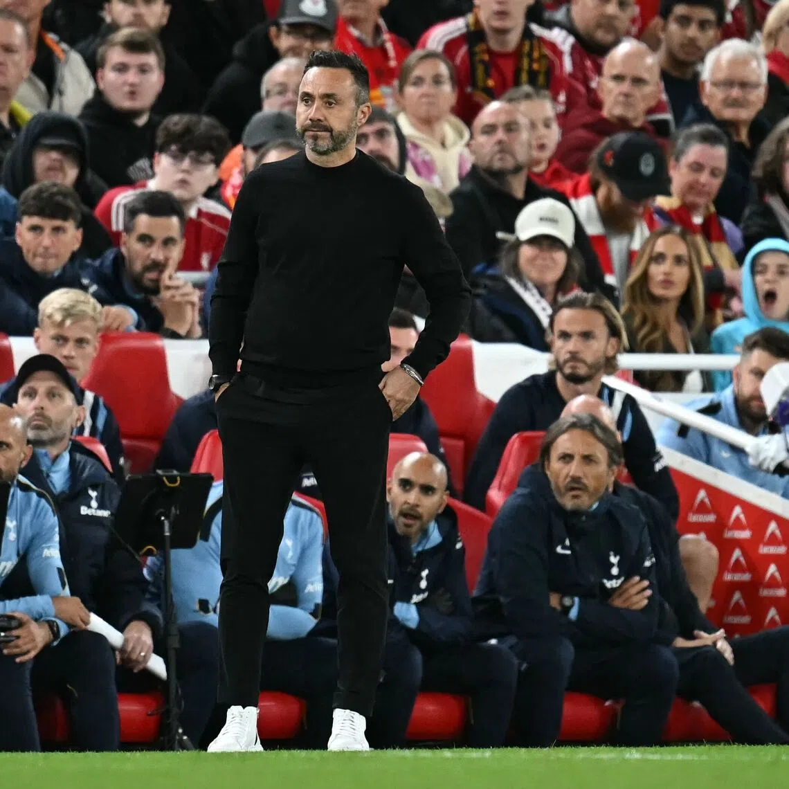 Tottenham Hotspur’s Italian head coach Roberto De Zerbi watches the players from the touchline as they played against Liverpool during the English League Cup third round match.
