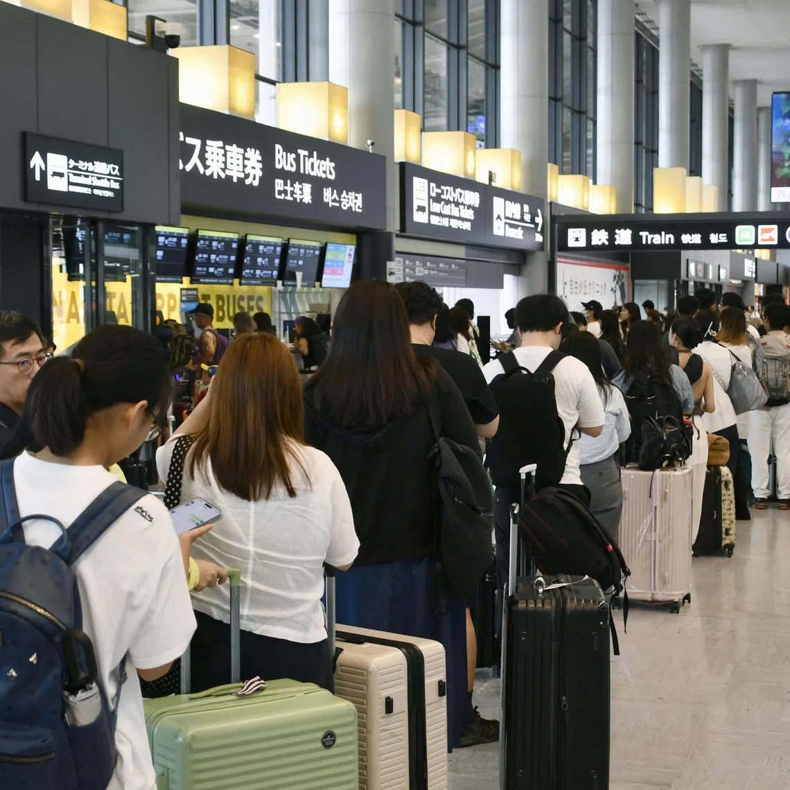 Travellers stranded due to heavy rain crowd Narita International Airport in Narita, Japan’s Chiba prefecture, on Aug 14.