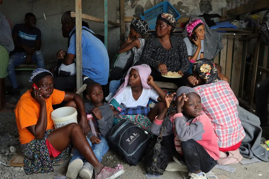 Residents rest while fleeing their homes near Cite Soleil after rival gang clashes worsened over the weekend in Haiti's capital, Port-au-Prince, Haiti, May 11, 2026. REUTERS/Fildor Pq Egeder