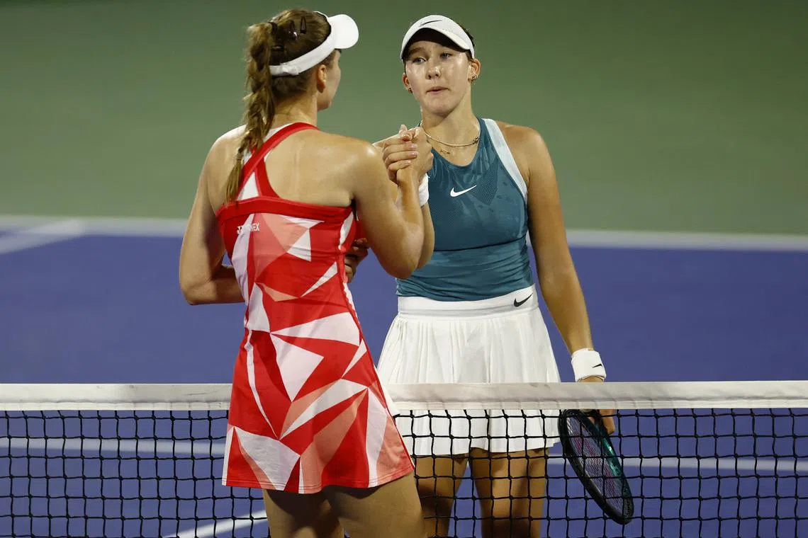 Tennis - Dubai Championships - Dubai Tennis Stadium, Dubai, United Arab Emirates - February 21, 2025 Russia's Mirra Andreeva shakes hands with Kazakhstan's Elena Rybakina after winning her semi final match REUTERS/Rula Rouhana