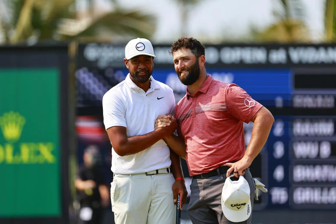 Tony Finau (left) shakes hands with Jon Rahm at the end of the last round of the Mexico Open.