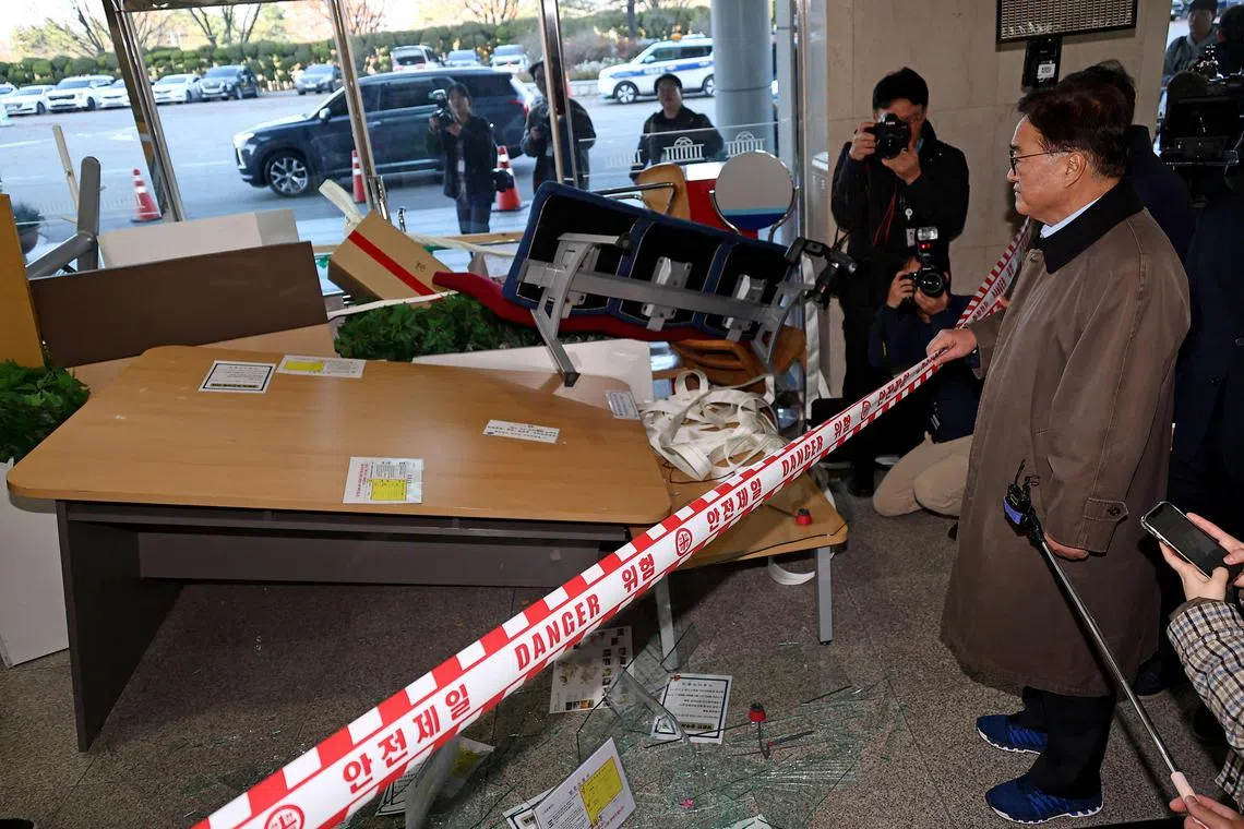 South Korean National Assembly Speaker Woo Won-sik inspecting damaged facilities at the National Assembly in Seoul on Dec 4.