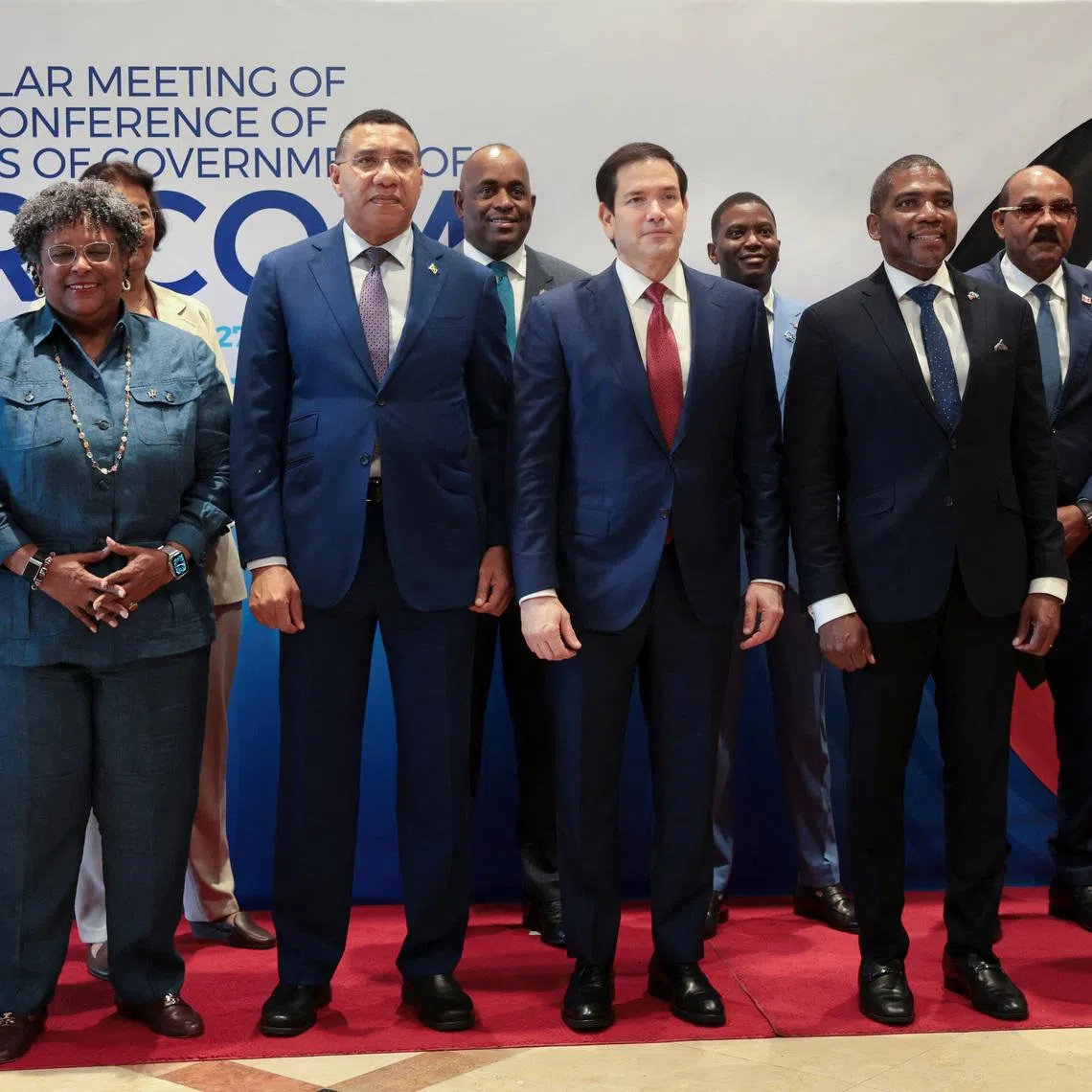 U.S. Secretary of State Marco Rubio poses for a family photo with Bahama's Prime Minister Philip Edward Davis, Grenada's Prime Minister Dickon Mitchell, Antigua and Barbuda's Prime Minister Gaston Browne, Barbados' Prime Minister Mia Amor Mottley, Jamaica's Prime Minister Andrew Holness and St. Kitts and Nevis Prime Minister Terrance Drew, alongside Caribbean Community (CARICOM) meetings, in Saint Kitts and Nevis, February 25, 2026. REUTERS/Jonathan Ernst/Pool