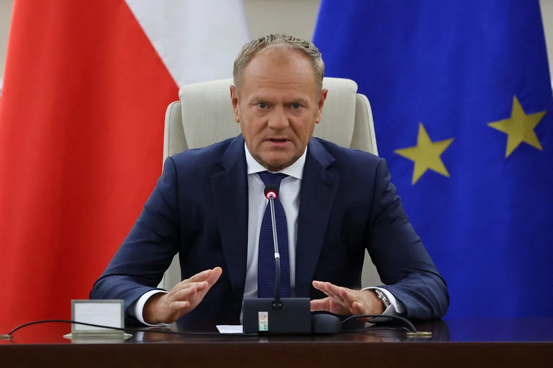 FILE PHOTO: Polish Prime Minister Donald Tusk holds an extraordinary government meeting at the Chancellery of the Prime Minister, with military and emergency services officials, following violations of Polish airspace during a Russian attack on Ukraine, in Warsaw, Poland, September 10, 2025. REUTERS/Kacper Pempel/ File Photo