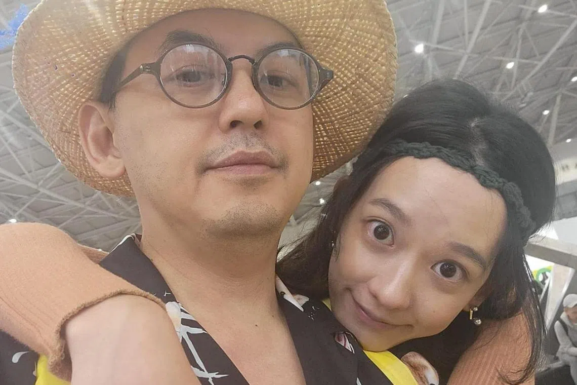 Taiwanese TV host Mickey Huang with his wife, actress Summer Meng.