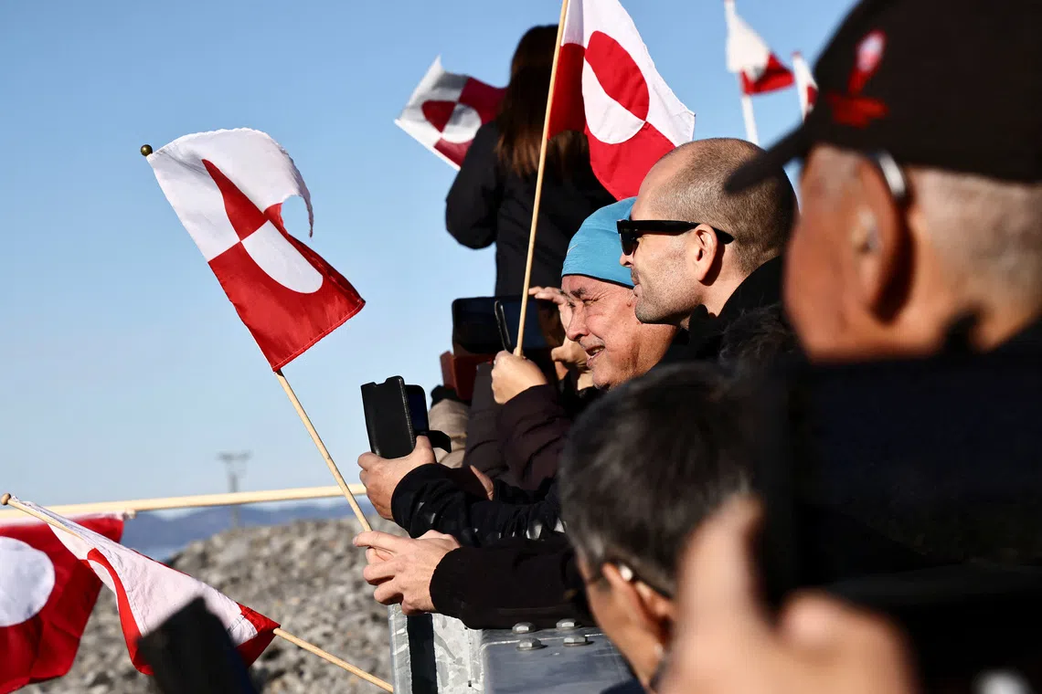 People wait for the arrival of the Greenlandic delegation after they agreed on a security deal with the US and Denmark at Nuuk Airport in Nuuk, Greenland, September 23, 2026. REUTERS/Tim Barsoe