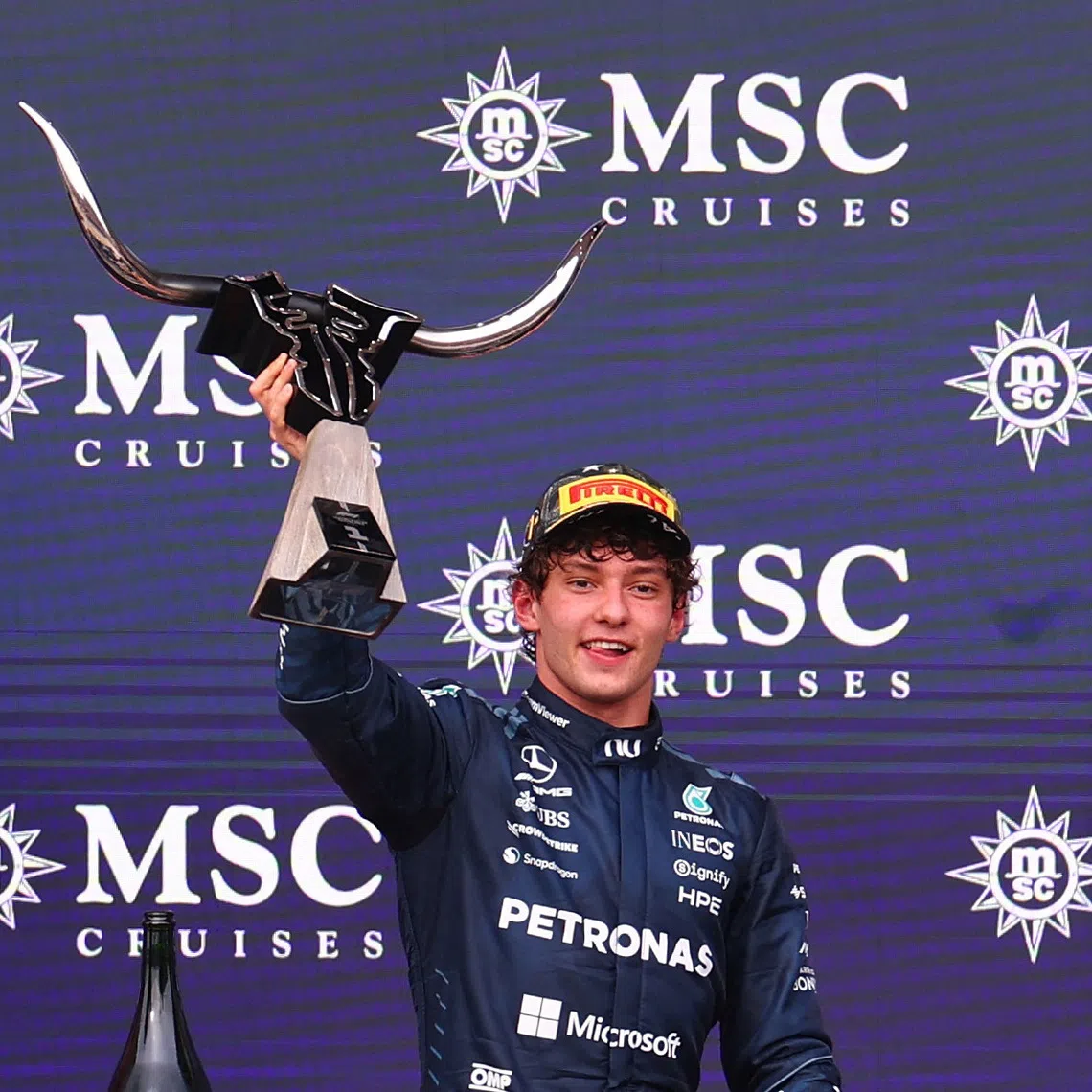 Mercedes’ Andrea Kimi Antonelli celebrates with the trophy on the podium after winning the US Grand Prix on Oct 25 in Austin, Texas.