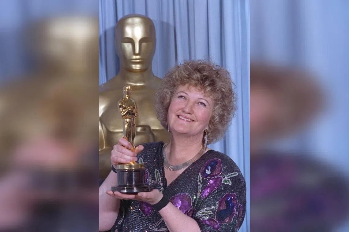 Brenda Fricker holds up her Oscar after winning the Best Supporting Actress category at Academy Awards on  March 26, 1990.