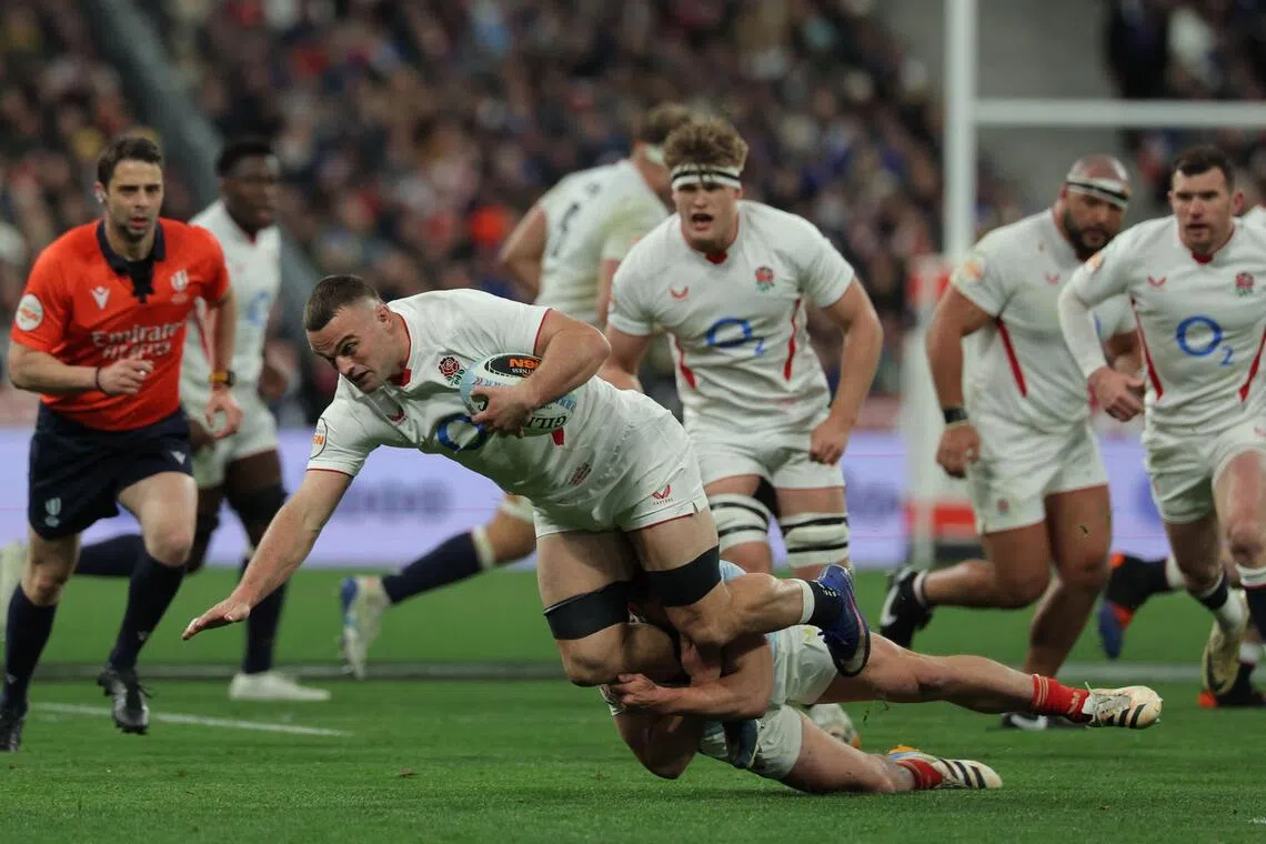 England's flanker Ben Earl is tackled as he runs with the ball during of the Six Nations match against France.
