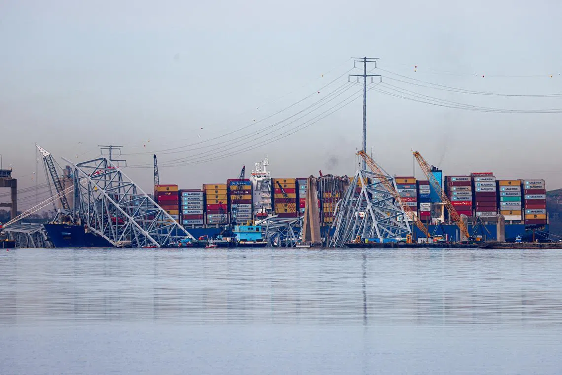 FILE PHOTO: Wreckage of the collapsed Francis Scott Key Bridge lies atop the container ship Dali as salvage work continues in Baltimore, Maryland, U.S., April 8, 2024. REUTERS/Julia Nikhinson/File Photo