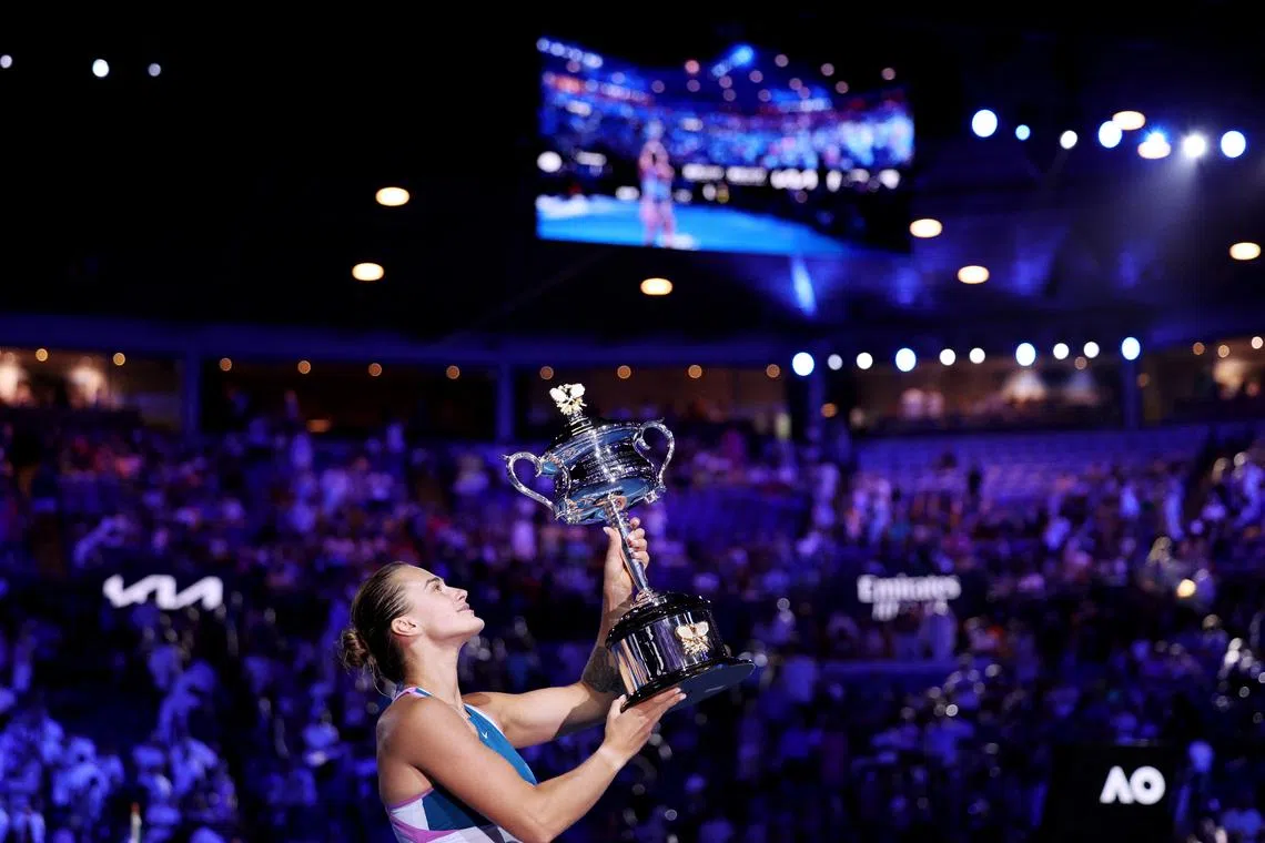FILE PHOTO: Tennis - Australian Open - Women's Singles Final - Melbourne Park, Melbourne, Australia - January 28, 2023 Belarus’ Aryna Sabalenka celebrates with the trophy after winning her final match against Kazakhstan’s Elena Rybakina REUTERS/Loren Elliott/File Photo