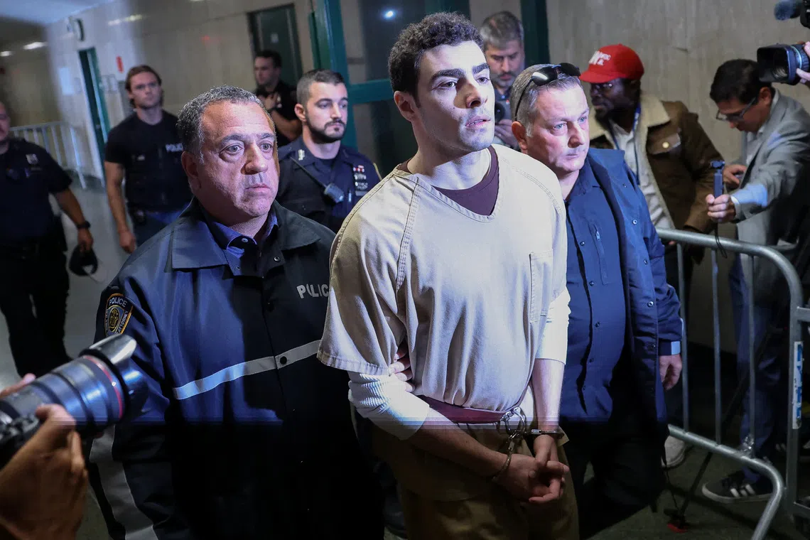 Luigi Mangione, the suspect in the killing of UnitedHealthcare chief executive Brian Thompson, is escorted at Manhattan Supreme Court on the day he appears on New York State murder and terrorism charges, in New York City, U.S., September 16, 2025. REUTERS/Mike Segar