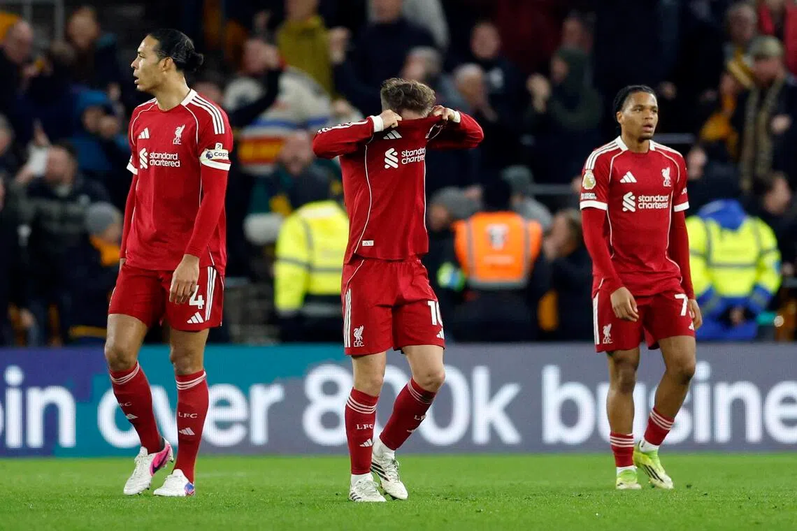 Liverpool's Alexis Mac Allister, Virgil van Dijk and Rio Ngumoha reacting to the winning goal being scored by after Wolverhampton Wanderers' Andre.