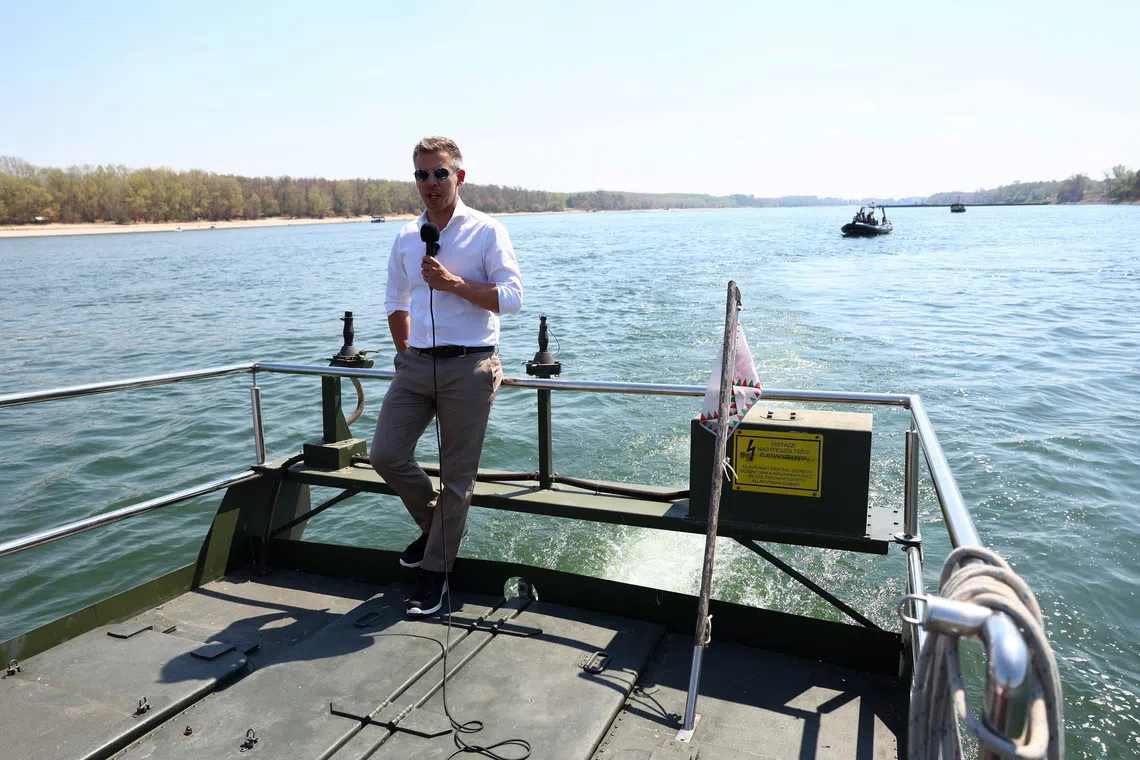 FILE PHOTO: Hungarian Prime Minister Peter Magyar talks to the media as he visits the construction site, where work is underway to raise the Danube's water level in Paks, Hungary, August 15, 2026. REUTERS/Bernadett Szabo/FIle Photo