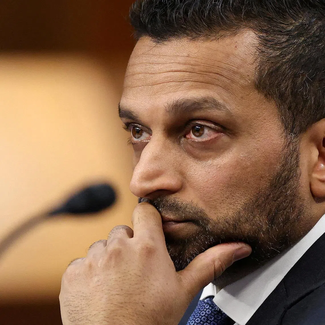 FILE PHOTO: FBI Director Kash Patel looks on, as he testifies before a Senate Intelligence Committee hearing on Capitol Hill in Washington, D.C., U.S., March 18, 2026.  REUTERS/Kevin Lamarque/File Photo