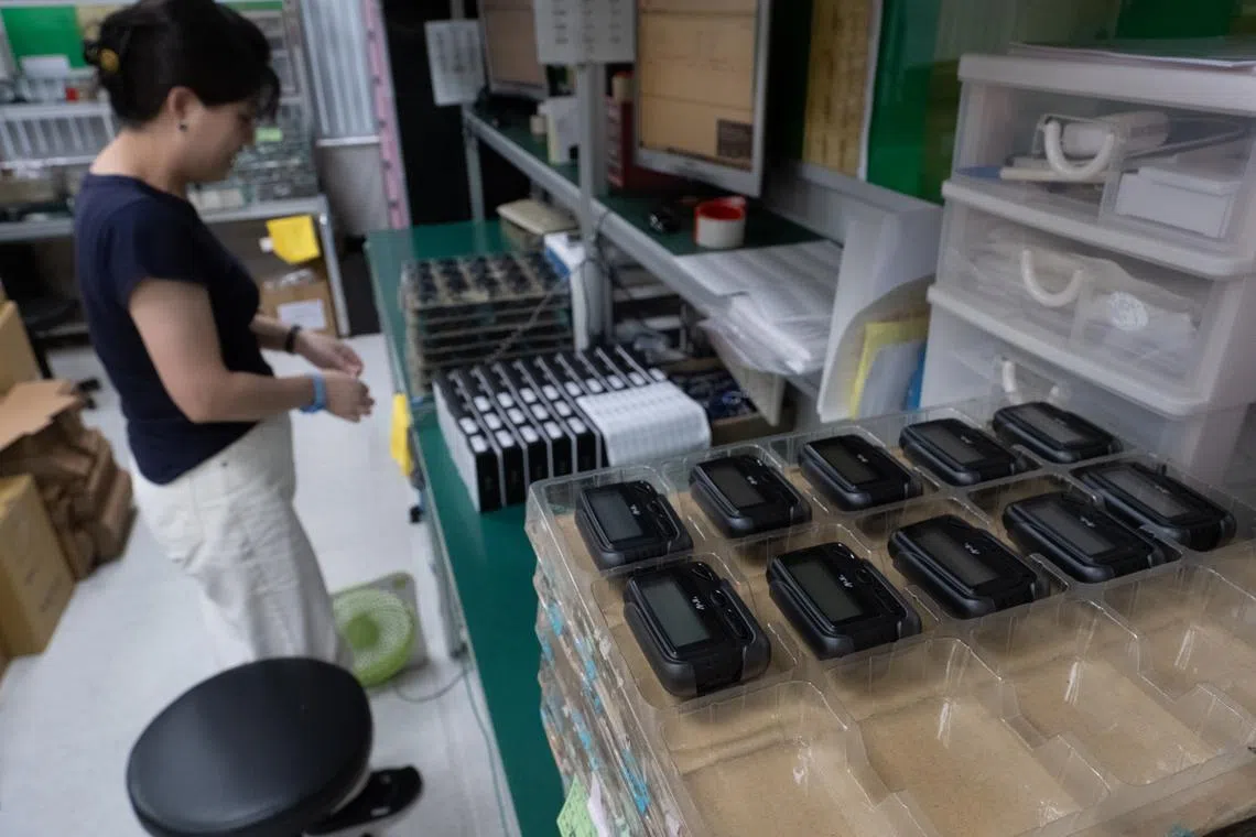 Pagers at the factory in Taipei of Gold Apollo, the Taiwanese company first named as the source of pagers that were remotely detonated in Lebanon, on Sept. 18.