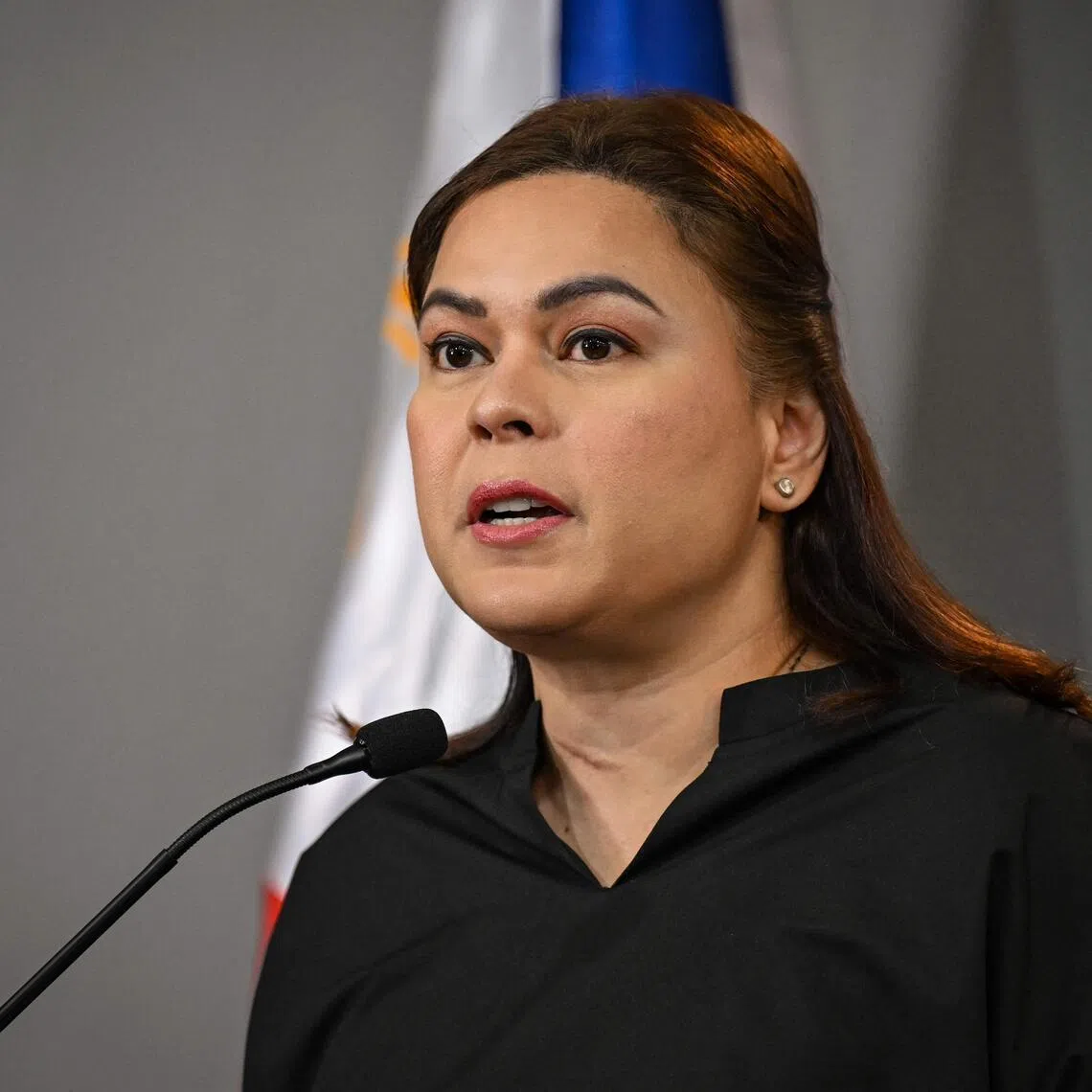 (FILES) Philippine Vice President Sara Duterte announces her intention to run for the country's presidency in 2028 during a press conference in Mandaluyong, Metro Manila on February 18, 2026. A Philippine congressional committee agreed overwhelmingly on March 4, 2026 to send articles of impeachment against Vice President Sara Duterte to lawmakers for a vote that could decide her political future. (Photo by Jam STA ROSA / AFP)