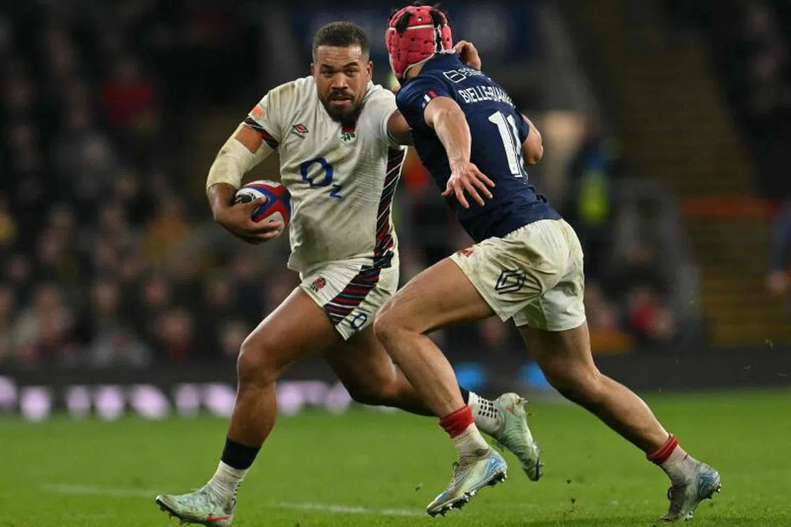France’s wing Louis Bielle-Biarrey tackles England’s centre Ollie Lawrence during the Six Nations international rugby union match between England and France at Allianz Stadium, Twickenham, in south-west London, on February 8, 2025. (Photo by Glyn KIRK / AFP)