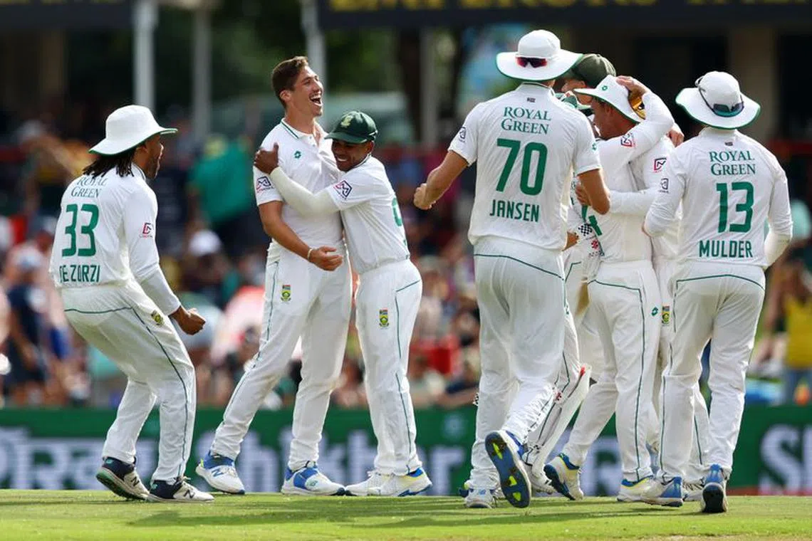 Cricket - First Test - South Africa v India - SuperSport Park Cricket Stadium, Centurion, South Africa - December 28, 2023 South Africa's Nandre Burger celebrates the wicket of India's Ravichandran Ashwin with teammates REUTERS/Esa Alexander/File Photo