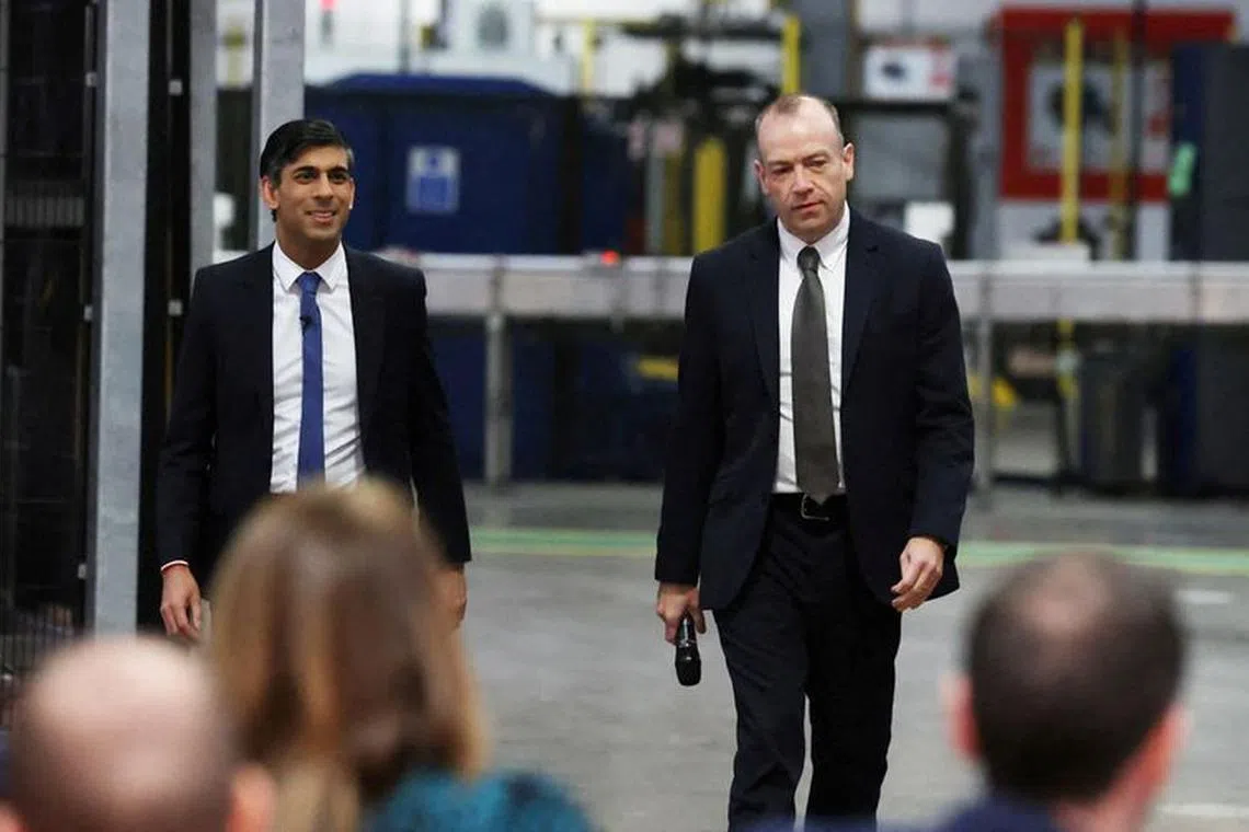 Prime Minister Rishi Sunak (left) and Northern Ireland Secretary Chris Heaton-Harris hold a Q&A session with local business leaders during a visit to Coca-Cola HBC in Lisburn, Co Antrim in Northern Ireland. February 28, 2023. Liam McBurney/Pool via REUTERS/File Photo