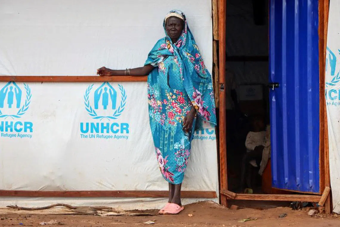 A Sudanese refugee woman stands outside a shelter at the Gorom Refugee camp hosting Sudanese refugees on World Refugee Day, to celebrate the strength and courage of people who have been forced to flee their home country to escape conflict under the theme \"hope away from home\" near Juba, in South Sudan June 20, 2023. REUTERS/Samir Bol