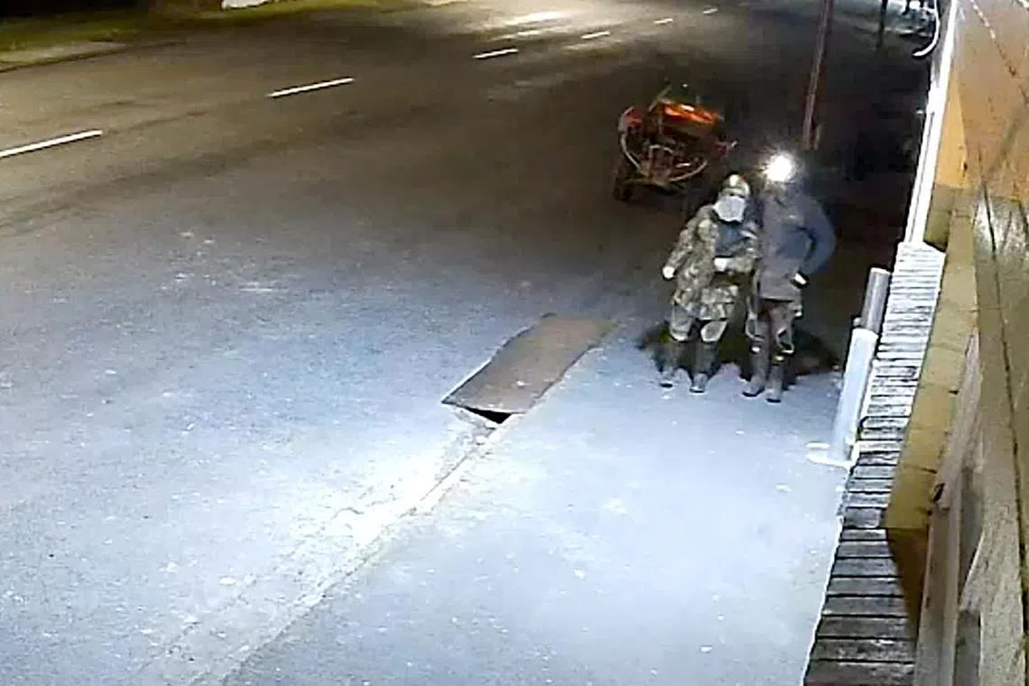 Fugitive New Zealand father Tom Phillips and one of his children steeling grocery items from a store in the northern New Zealand region of Waikato. 