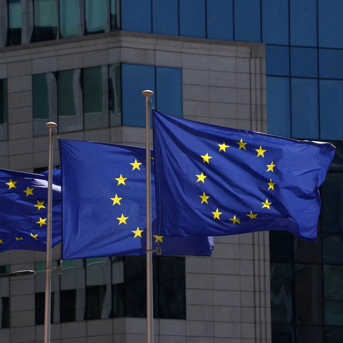 FILE PHOTO: European Union flags flutter outside the European Commission headquarters in Brussels, Belgium April 29, 2026. REUTERS/Yves Herman/File Photo