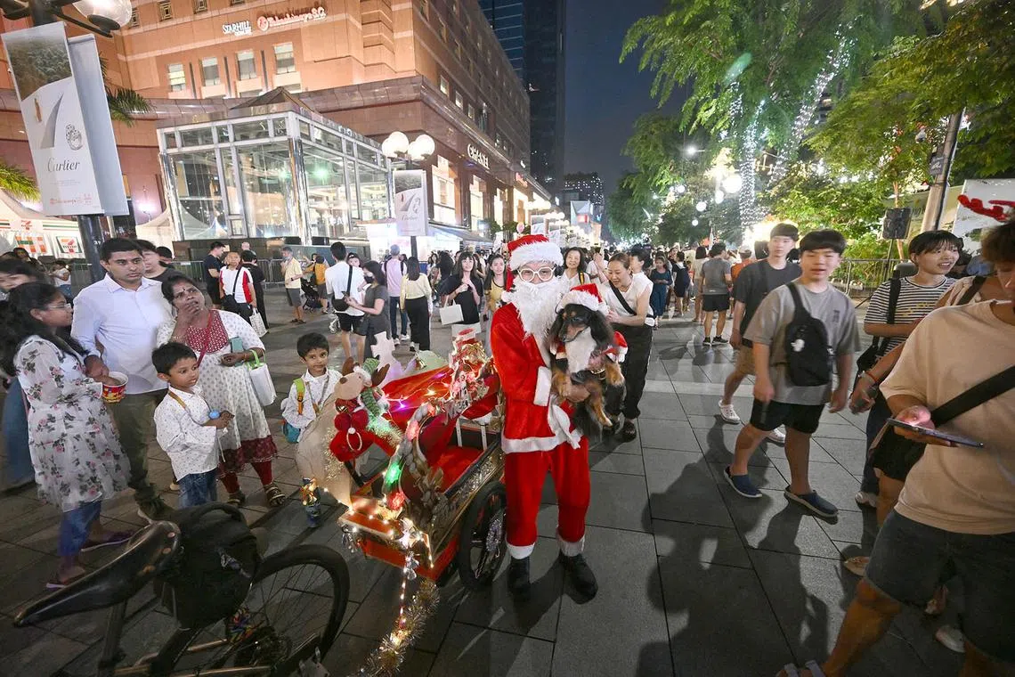 Mr Matthew Koh, 56, interior project manager. He dressed up as Santa Claus and cycled to Orchard Road from his home in Serangoon North. He has been doing this for seven year as he wants to make everybody happy.