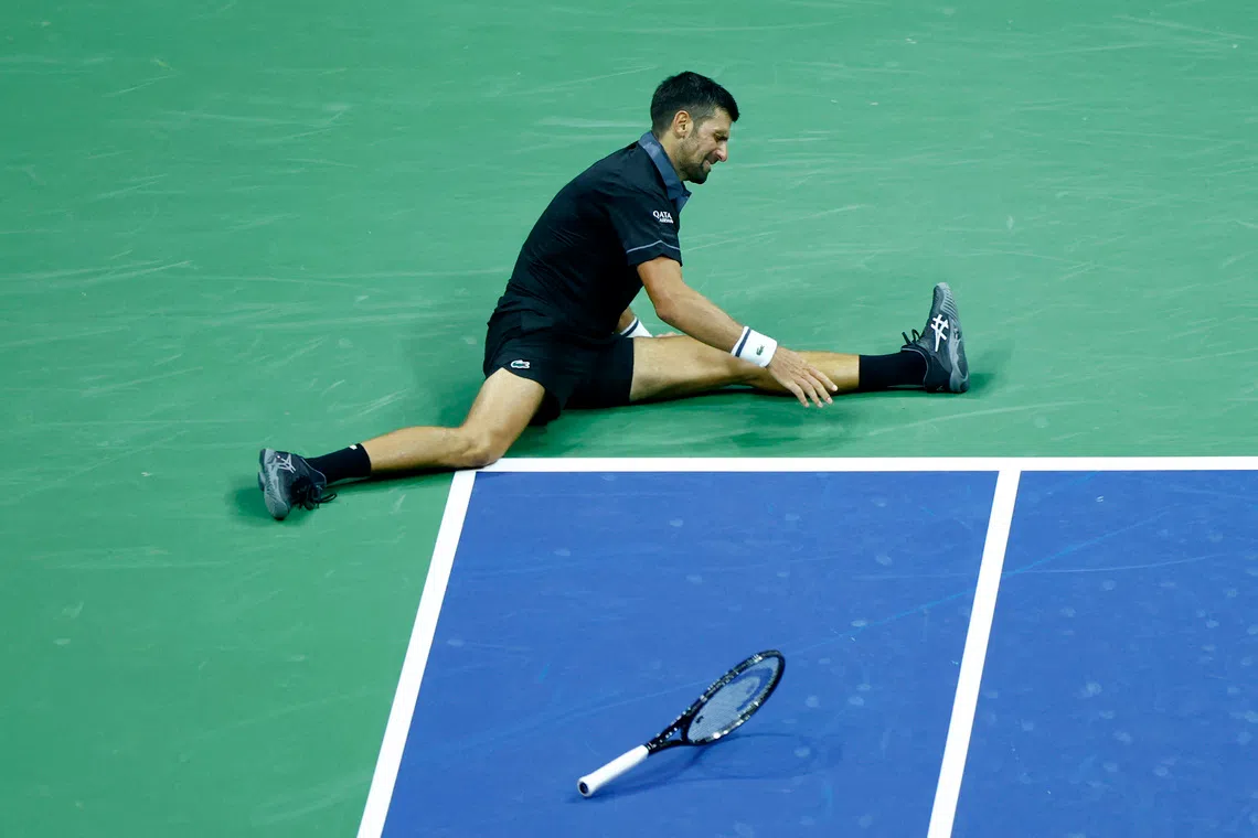 Tennis - U.S. Open - Flushing Meadows, New York, United States - August 30, 2026 Serbia's Novak Djokovic lies on the court during his first round match against Argentina's Mariano Navone REUTERS/Jeenah Moon