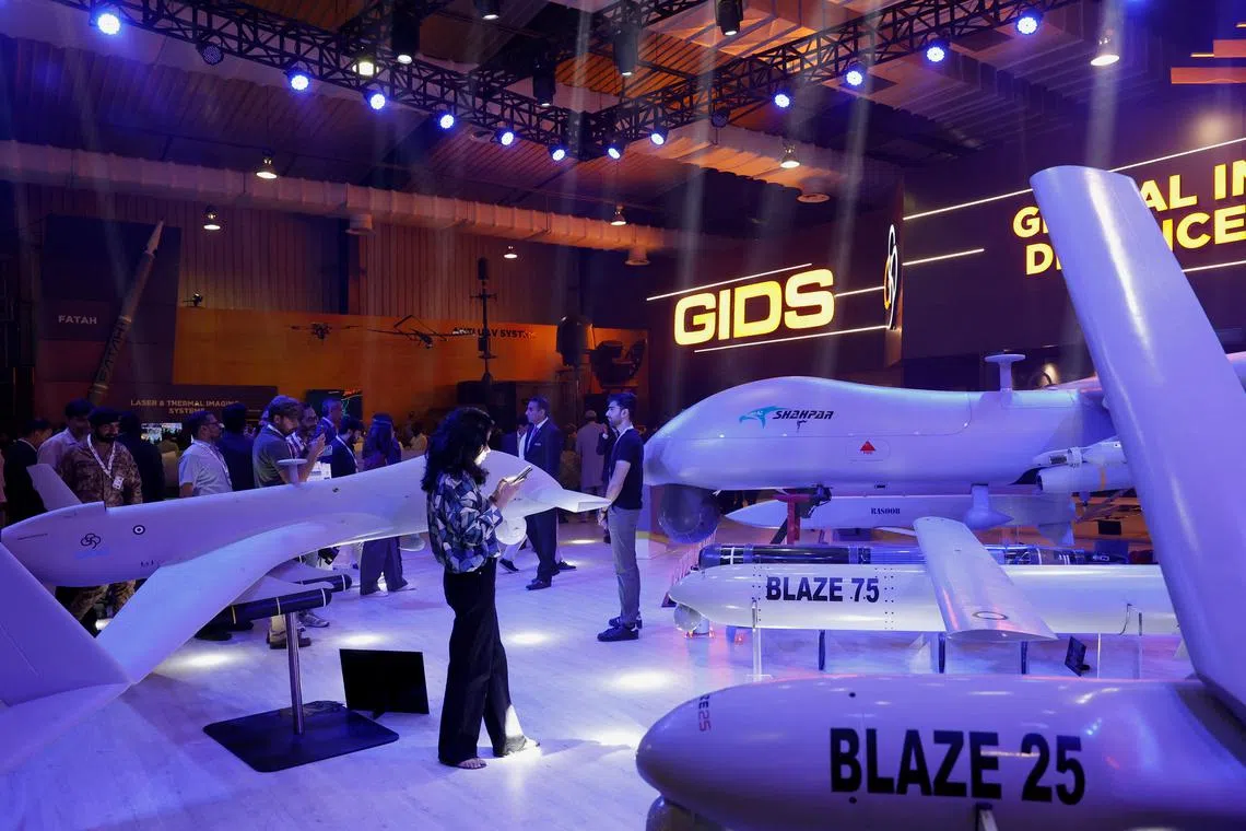 Visitors inspect the Global Industrial & Defence Solutions (GIDS) unmanned combat aerial vehicle (UCAV) Shahpar during the International Defence Exhibition and Seminar (IDEAS 2024) in Karachi, Pakistan November 21, 2024. REUTERS/Akhtar Soomro