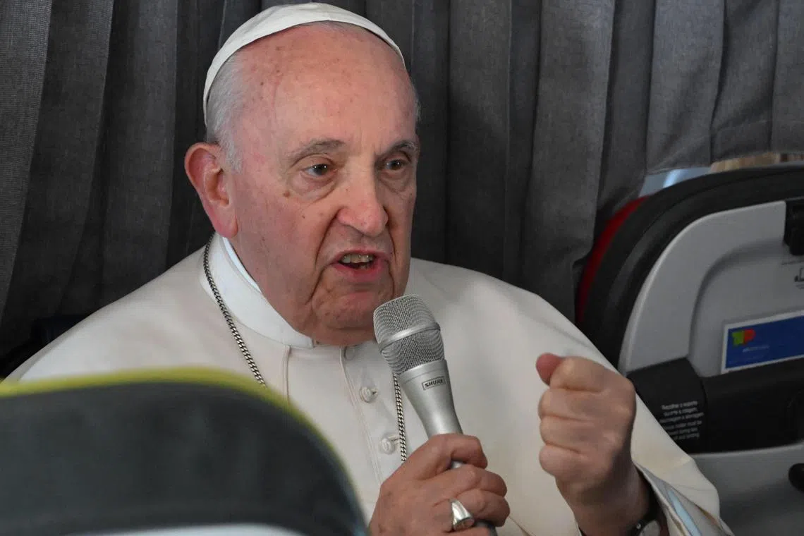 Pope Francis speaking to reporters on the plane returning to Rome from Portugal.