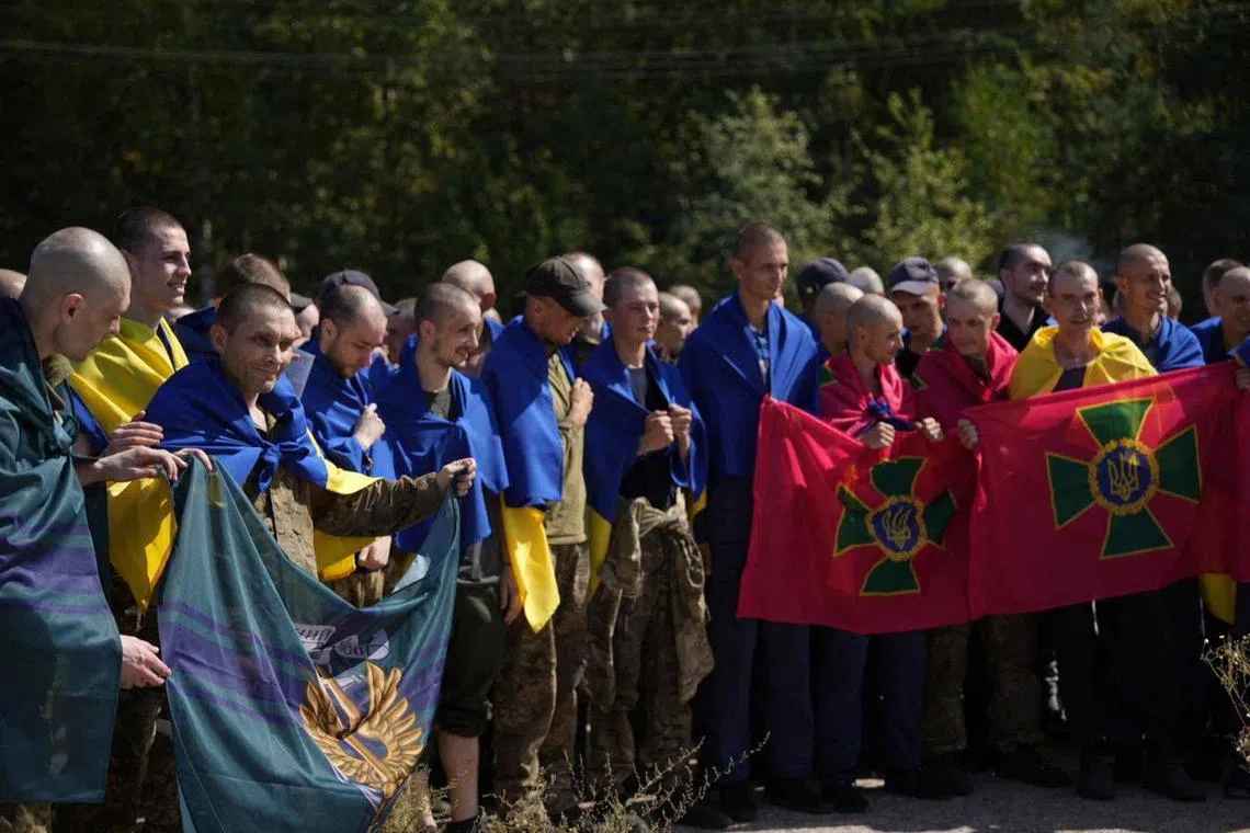 Ukrainian prisoners of war (POWs) gather after a swap, amid Russia's attack on Ukraine, at an unknown location in Ukraine, in this handout picture released August 24, 2024. Ukraine's President Volodymyr Zelenskiy via Telegram/Handout via REUTERS