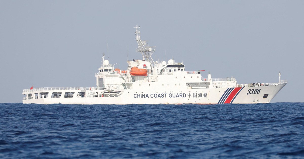 China’s coast guard monitors the Philippines resupplying vessel at disputed shoal