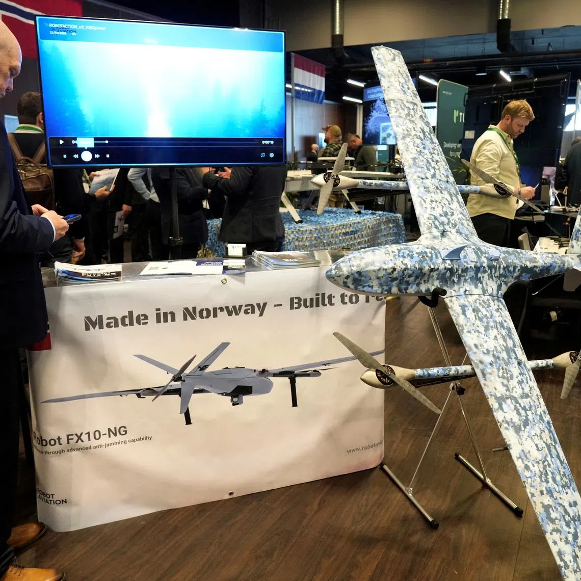 A man stands next to Robot Aviation's FX10NG drone displayed during the international Drone Summit in Riga, Latvia May 27, 2026. REUTERS/Ints Kalnins