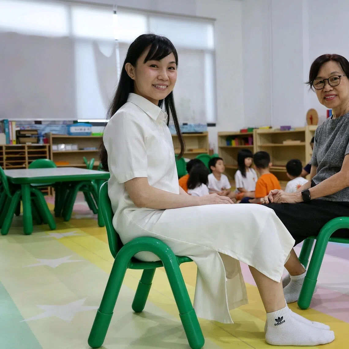 Ms Poh Ying Xia (left), 38, co-founder of Sunny Bunny Montessori Infantcare and Preschool, and her mother, Ms Ng Chooi Choo, 68, a retired teacher, at the preschool on March 10, 2026. Feature on inter-generational learning: Ying Xia, who bought over her autistic son's preschool, and her retired mother, a former teacher, are doing an NIE diploma course on early childhood development together.