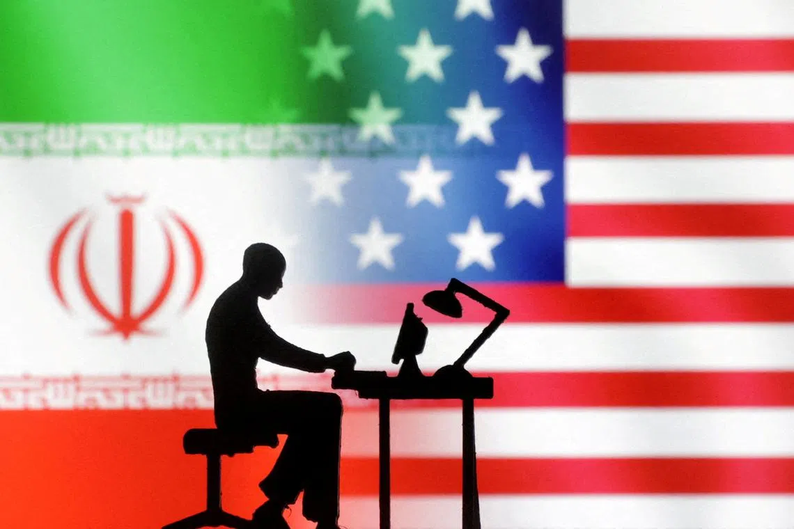 FILE PHOTO: Figurines with computers are seen in front of USA and Iran flags in this illustration taken, September 10, 2022. REUTERS/Dado Ruvic/Illustration/File Photo