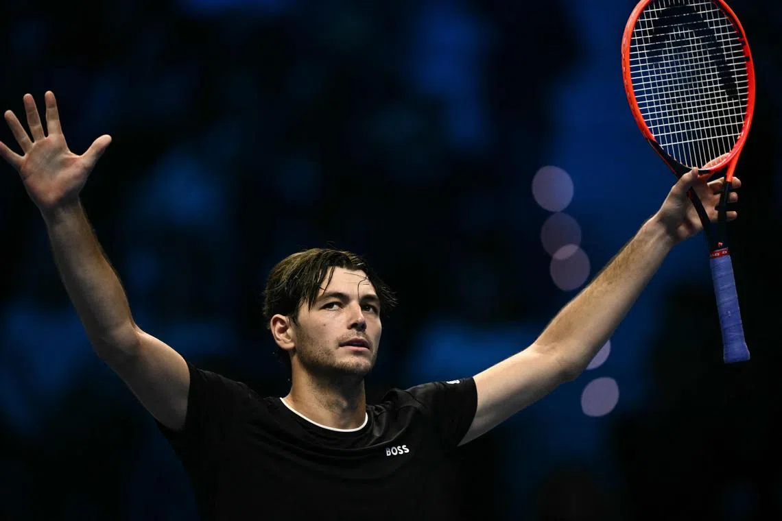 Taylor Fritz of the US celebrating his victory over Australia's Alex De Minaur on Nov 14.