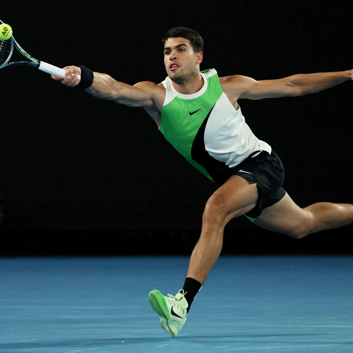 FILE PHOTO: Tennis - Australian Open - Melbourne Park, Melbourne, Australia - January 18, 2026 Spain's Carlos Alcaraz in action during his first round match against Australia's Adam Walton REUTERS/Hollie Adams/File Photo