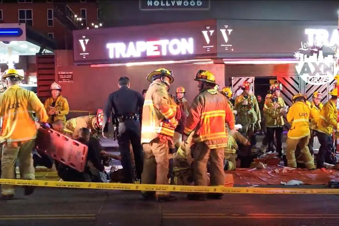 Members of emergency services work at the scene after a vehicle plunged into a crowd outside a nightclub, on Santa Monica Boulevard, Los Angeles, on July 19, 2025, in this screen grab obtained from social media.
