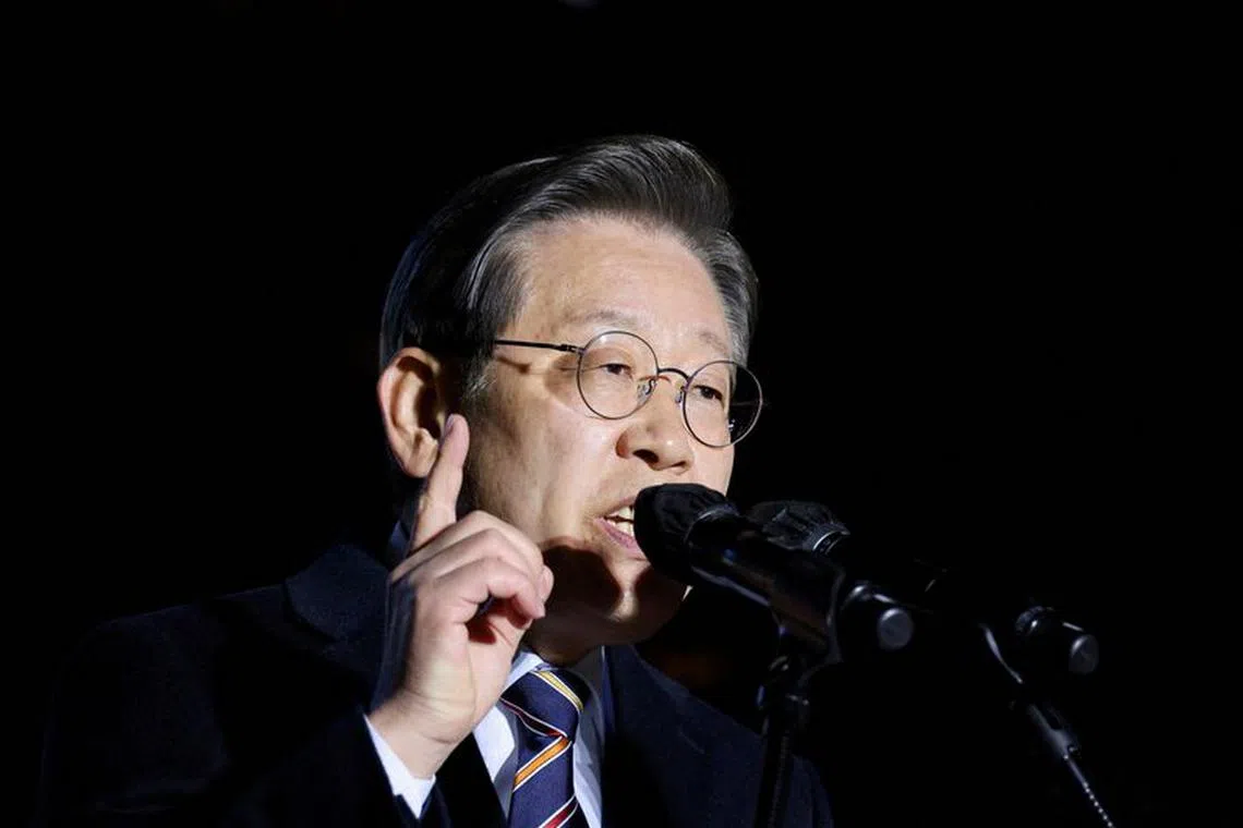 FILE PHOTO: Lee Jae-myung, leader of South Korea's Democratic Party, speaks at campaign rally while campaigning for the presidential election in Seoul, South Korea March 8, 2022. REUTERS/Kim Hong-Ji/File Photo