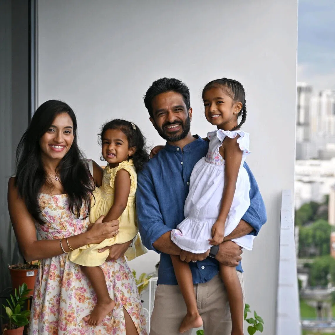 Jeggan Roman Rajendram, stay at home dad, Sumyutha Sivamani, lawyer, with their daughters, Jiya Sonya Rajendram (in white) and Rhea Samara Rajendram at their home on Apr 28.