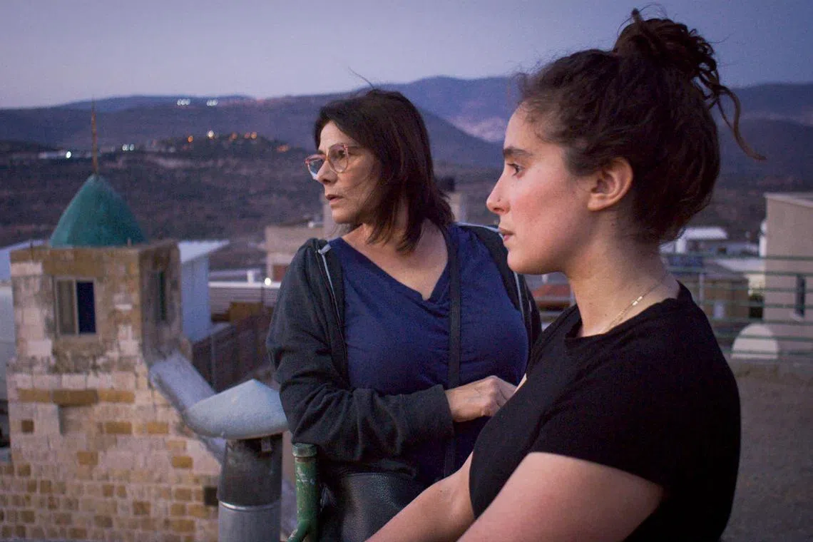 L-R Palestinian actress and director  Hiam Abbass and her film-maker daughter Lina Soualem in the village of Deir Hanna in the documentary Bye Bye Tiberias.



Source: Singapore Film Society