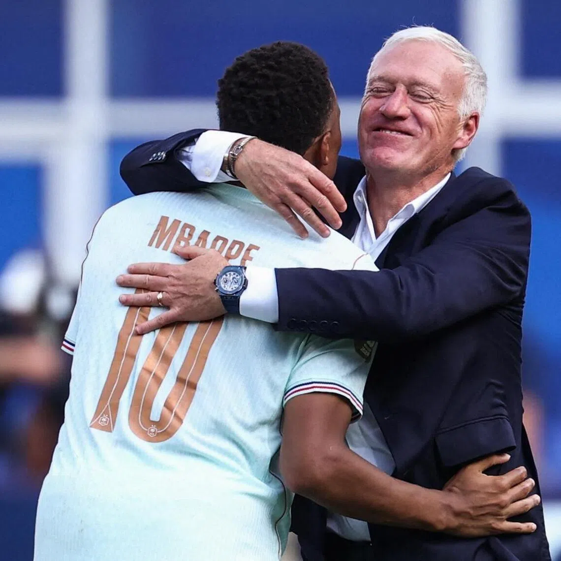 TOPSHOT - France's forward #10 Kylian Mbappe and head coach Didier Deschamps hug after winning the 2026 World Cup football tournament quarter-final match between France and Morocco at Boston Stadium in Foxborough on July 9, 2026.  (Photo by FRANCK FIFE / AFP)